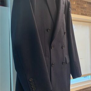 An Oliver Brown- London , double-breasted suit in a refined Air Force blue.